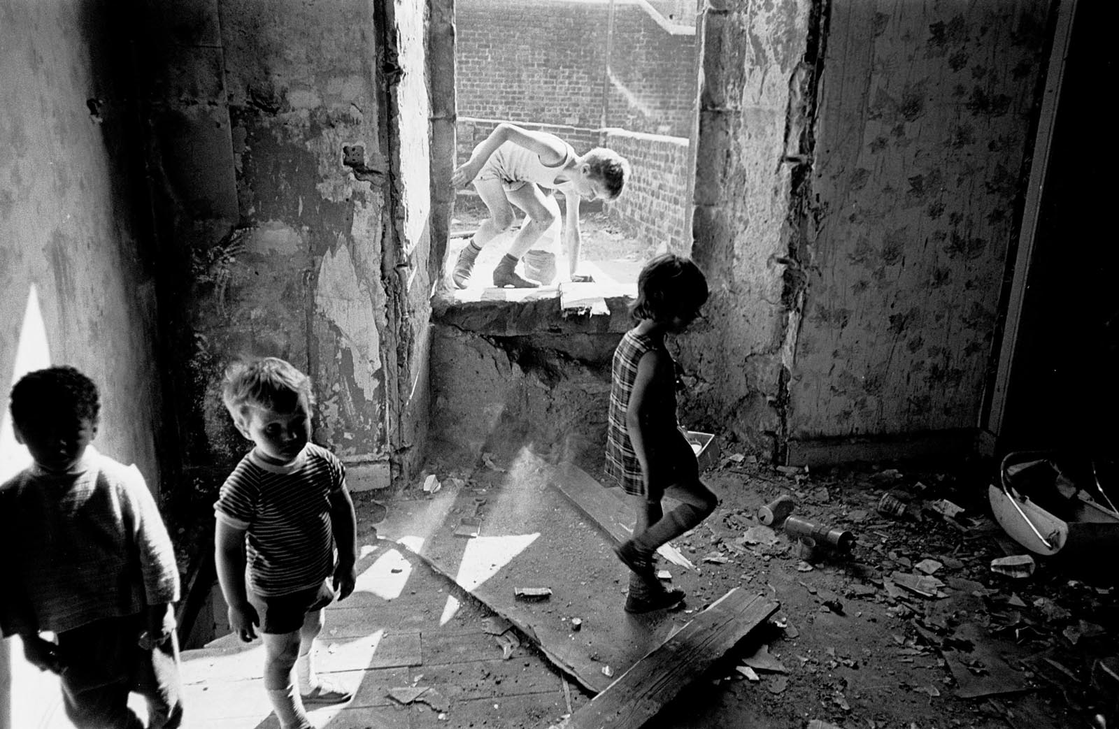 Children playing in a derelict tenement. Glasgow