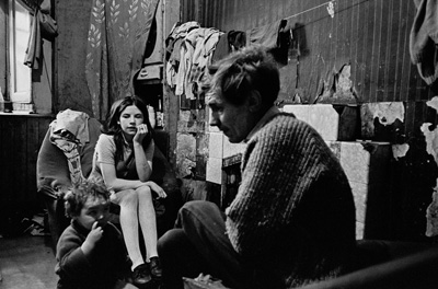 Father and children. Gorbals tenement. Glasgow, 1970